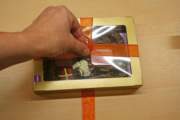 Holding Ribbon Around a Gift Box