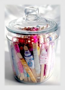 how to easily store small ribbon scraps in glass jar