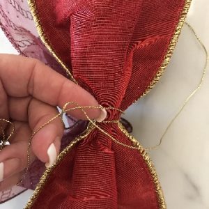 Tie Secure Knot on Reverse Side of Bow