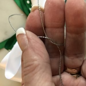 Tie Secure Knot on Back Side of Bow