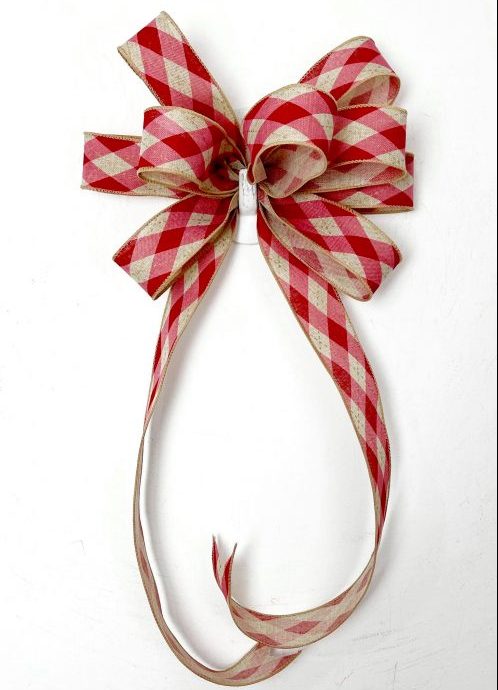 A Traditional bow with red chequered ribbon roll