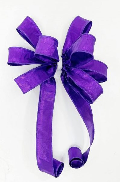 A Traditional bow with purple ribbon roll 