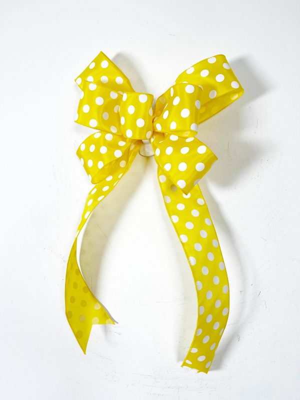 Yellow-white polka dotted ribbon bow