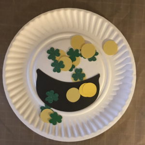 Lay Shamrocks and Coins Loose on Paper Plate