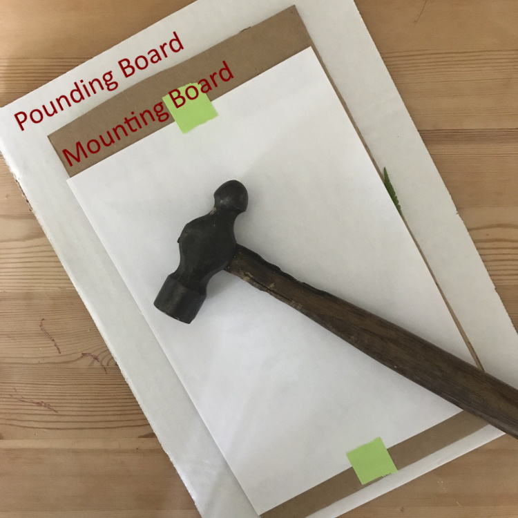 Lay Mounting Board on Pounding Board and Hammer