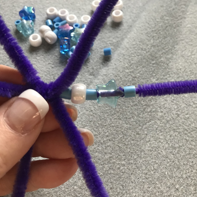 Thread Beads on Each Arm of Snowflake