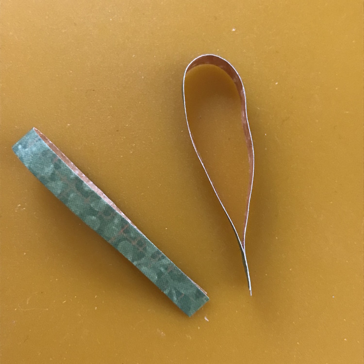 Glue End of Thin Strip Together to Form Antennae