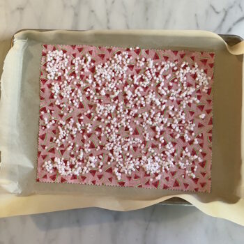 Spread Beeswax Pellets over Cloth